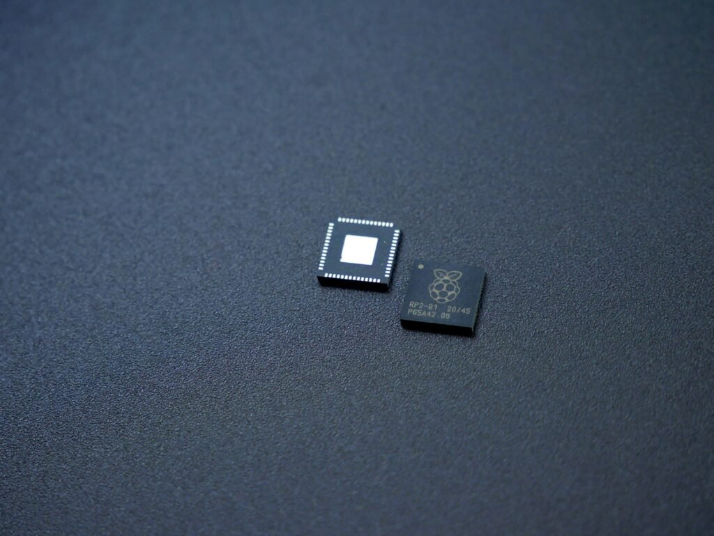 chips Photo by <a href="https://unsplash.com/@vishnumaiea?utm_content=creditCopyText&utm_medium=referral&utm_source=unsplash">Vishnu Mohanan</a> on <a href="https://unsplash.com/photos/a-couple-of-microchips-sitting-on-top-of-a-table-hus1z0tYELg?utm_content=creditCopyText&utm_medium=referral&utm_source=unsplash">Unsplash</a>